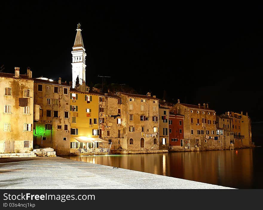 Night scene: a kind on Rovinj bay from landing stage. A cathedral of St. Evfimii. Night scene: a kind on Rovinj bay from landing stage. A cathedral of St. Evfimii.