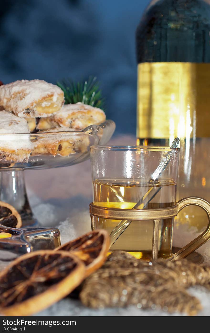 White glow-wine with cookies and winter-decoration. White glow-wine with cookies and winter-decoration