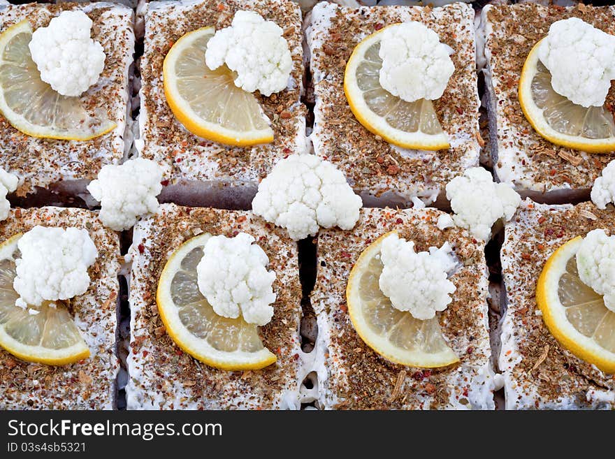 Fried fish with a cauliflower and mushrooms