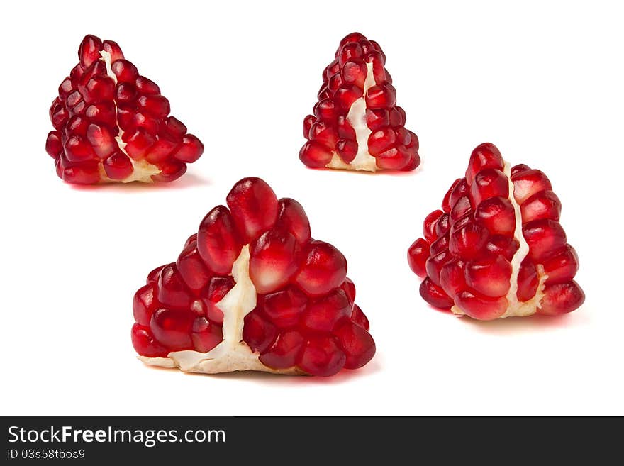 Pomegranate seeds against white background