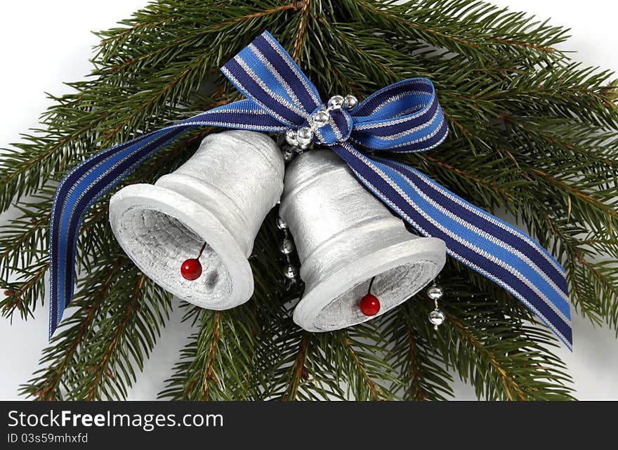 Two silvery bells on twigs of the spruce