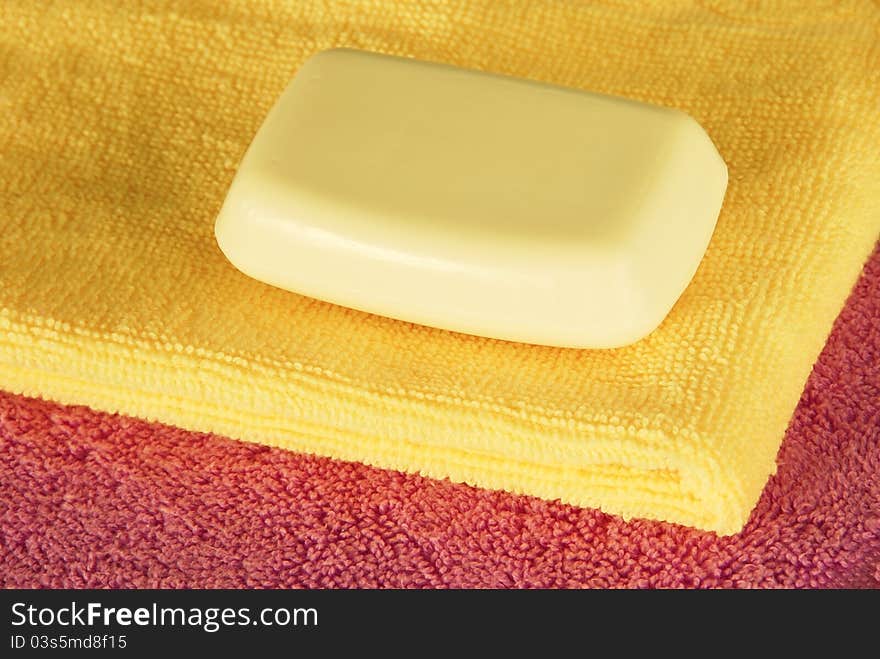 Soap bar on colorful towels