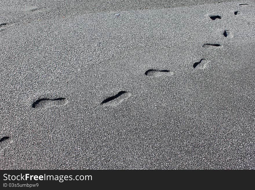 Adult footprints in the sand on the beach. Adult footprints in the sand on the beach