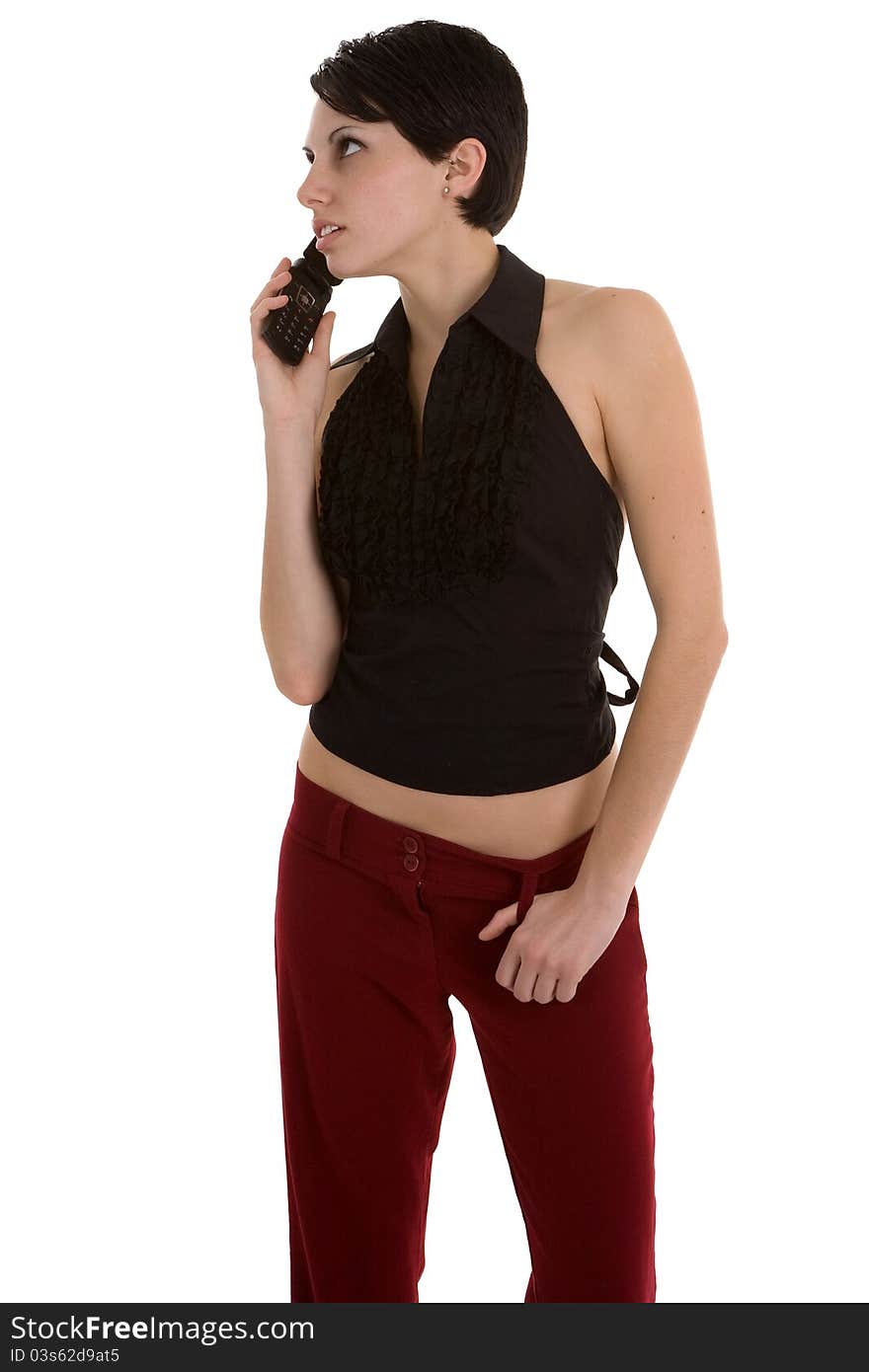 Young female fashion model in black top and red slacks on whtie background. Young female fashion model in black top and red slacks on whtie background