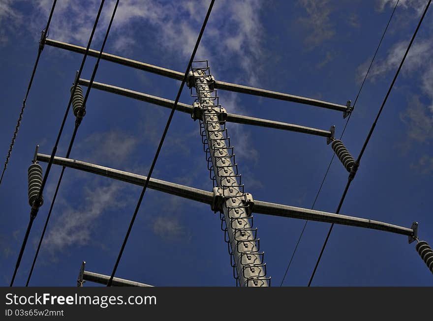 Power Line Tower against blue sky with clouds. Power Line Tower against blue sky with clouds