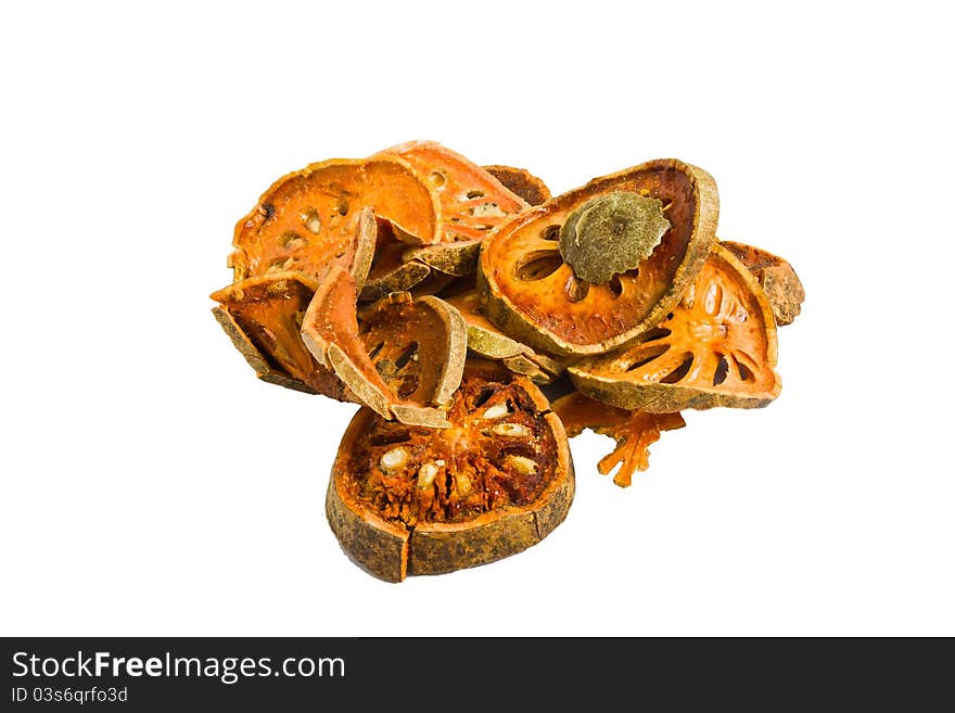 Slices of dried bael fruit on white background