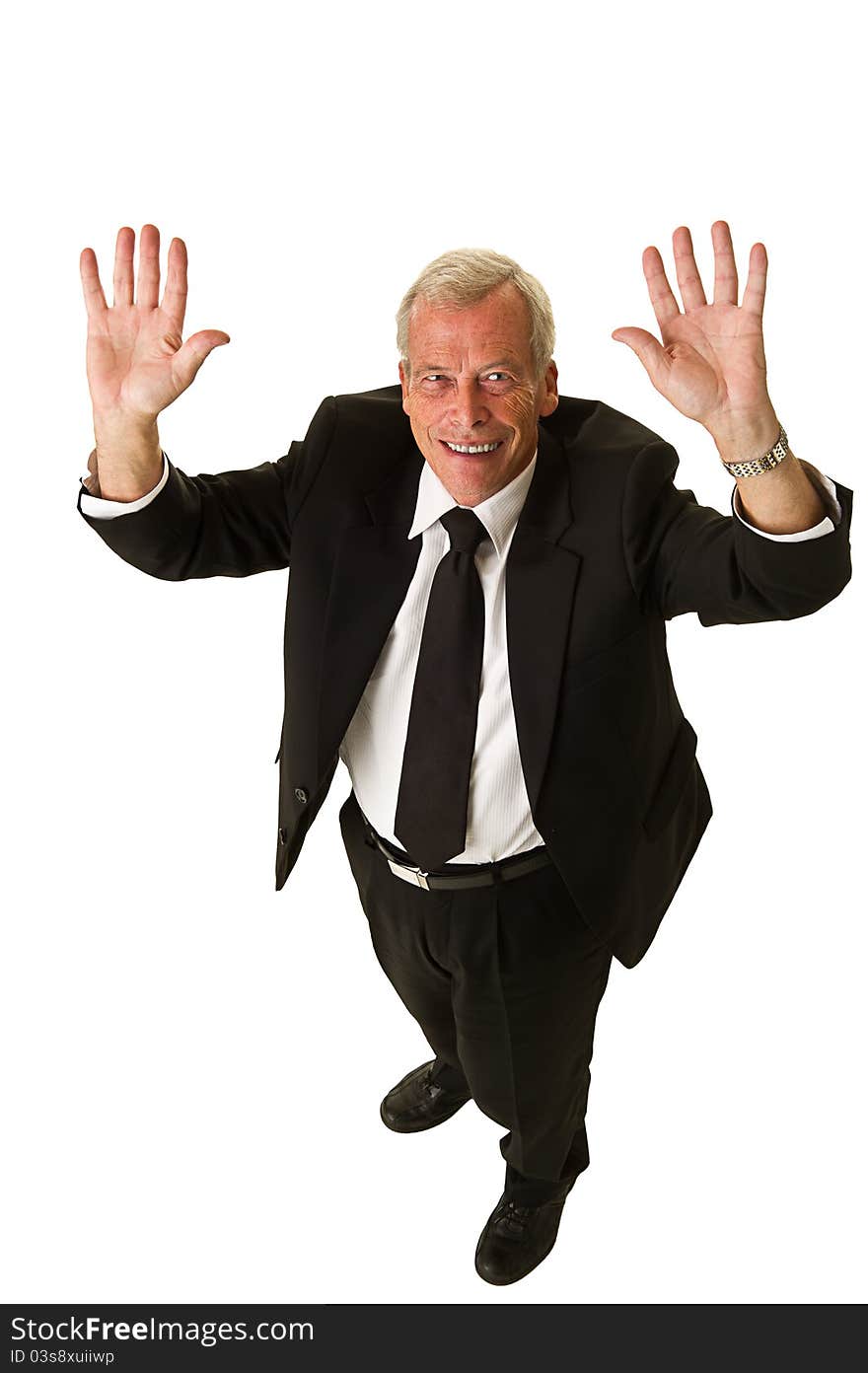 Happy business man in black suit celebrating over a white background