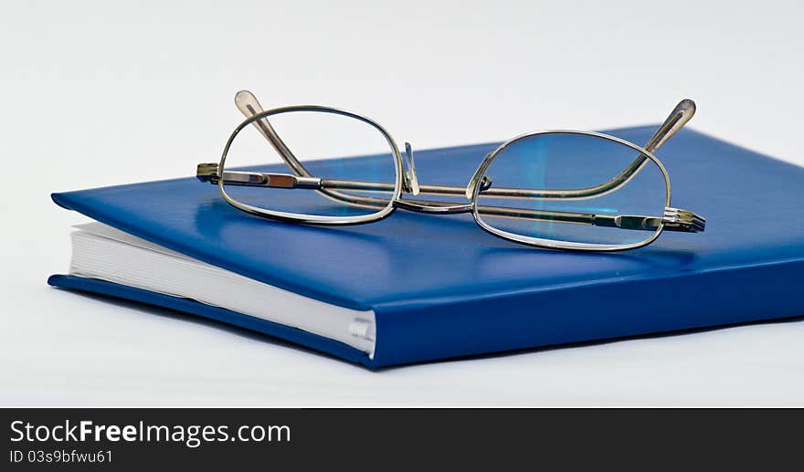 Book And Glasses