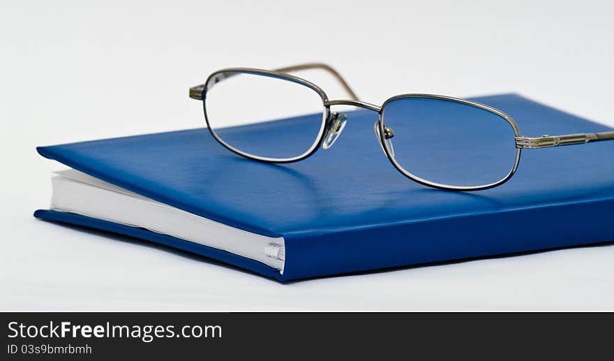 Book and glasses