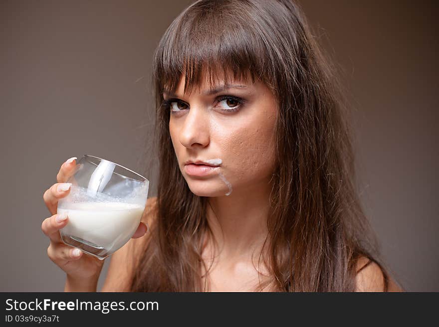 Portrait of beautiful woman drinking milk. Portrait of beautiful woman drinking milk