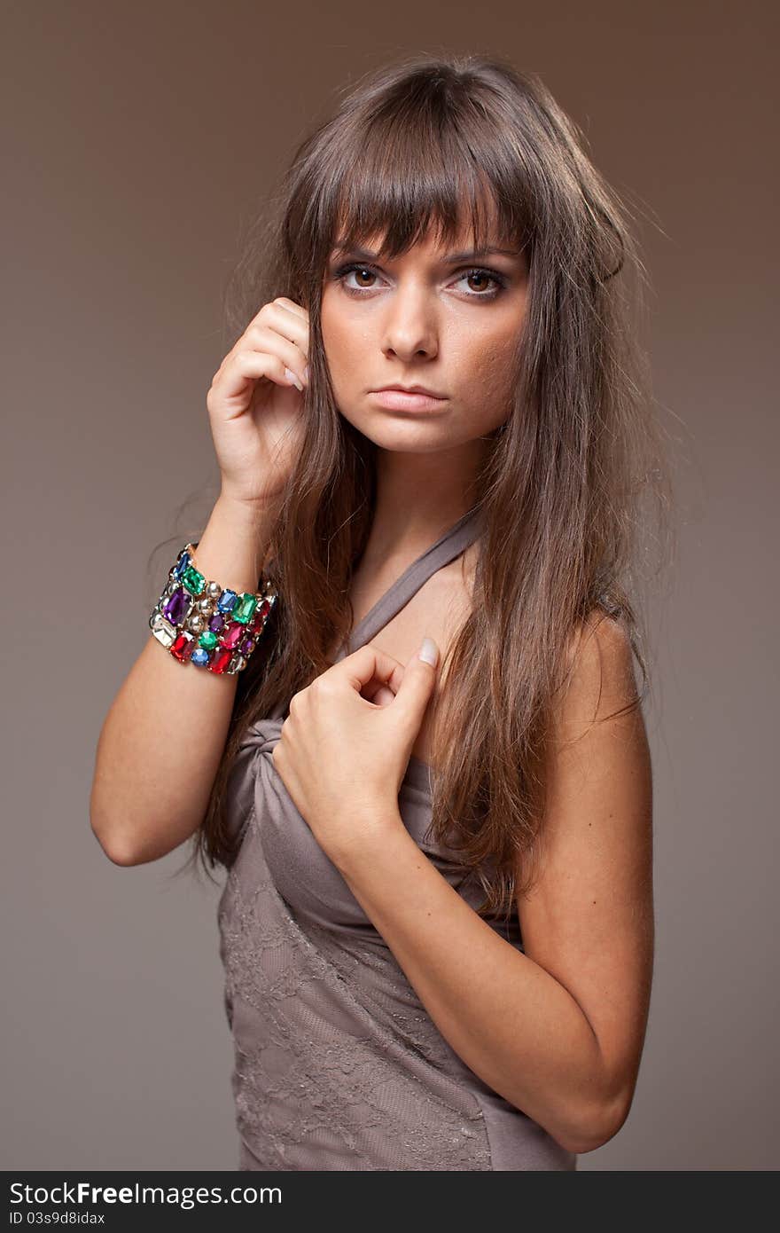 Portrait of beautiful model dressed in brown on brown