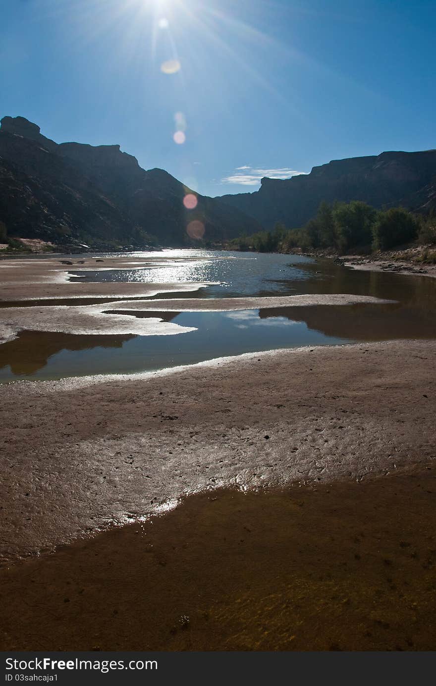 The sun shining over a riverbed, Fish River Canyon, Namibia. The sun shining over a riverbed, Fish River Canyon, Namibia