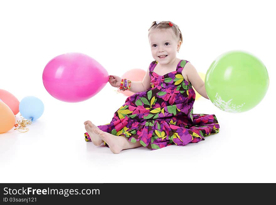 Little girl in a bright dress isolated on a white background.