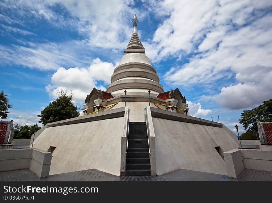 White pagoda in Wat Phra That Pha Ngao on blue sky background