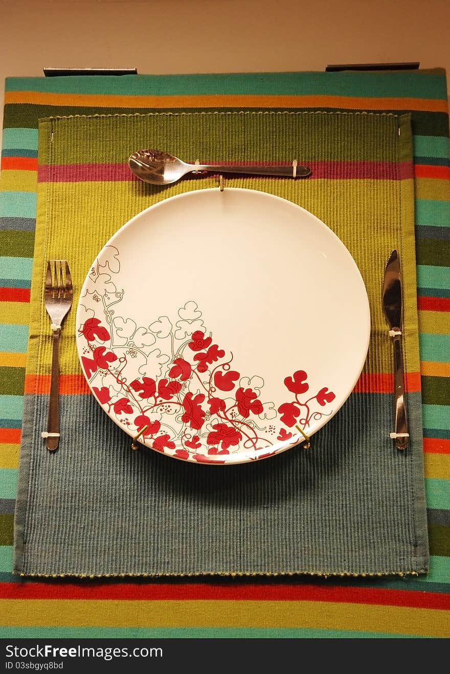 White plate on the cloth for sale with knife,fork,and spoon. White plate on the cloth for sale with knife,fork,and spoon.