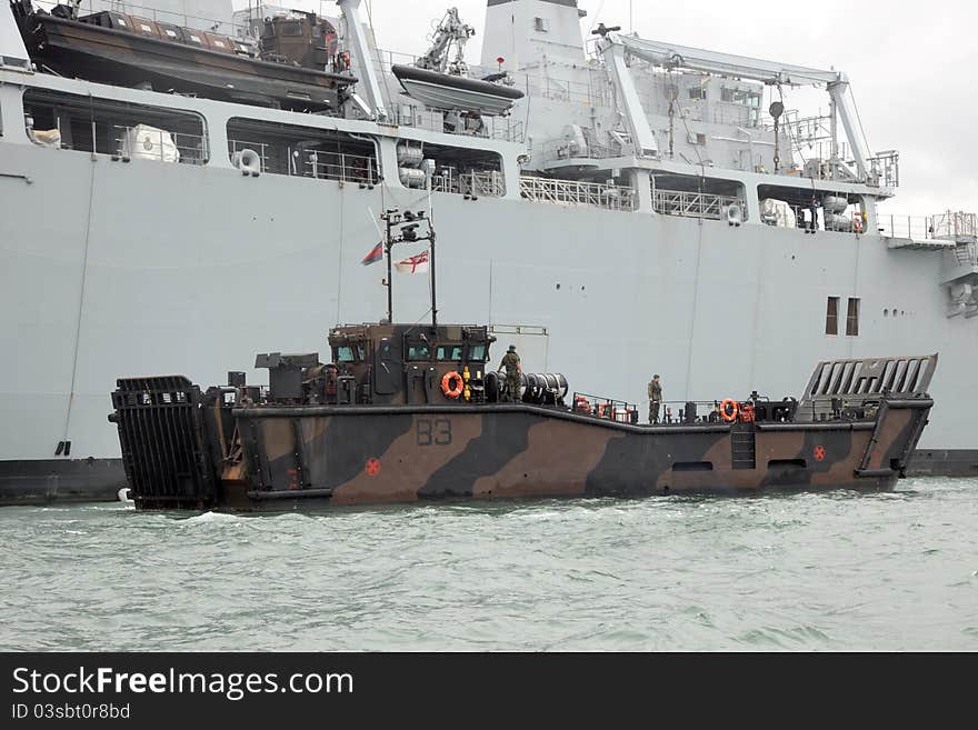 An LCU Mk10 landing craft of the Marine Landing Craft Unit, 4 Assault Squadron Royal Marines, alongside HMS Bulwark. An LCU Mk10 landing craft of the Marine Landing Craft Unit, 4 Assault Squadron Royal Marines, alongside HMS Bulwark.