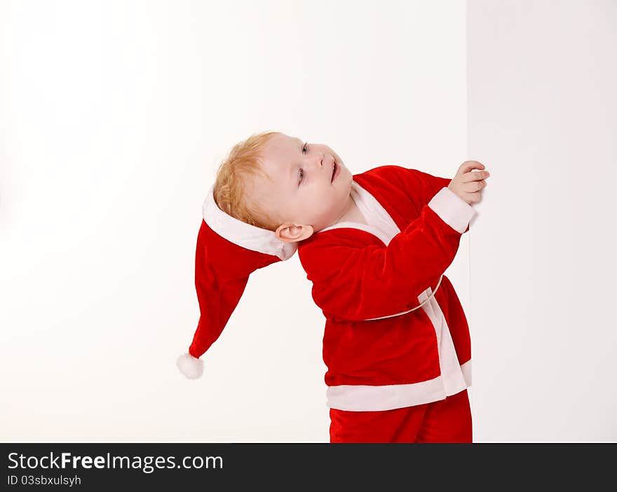 Child dressed as Santa Claus on a white background. Child dressed as Santa Claus on a white background