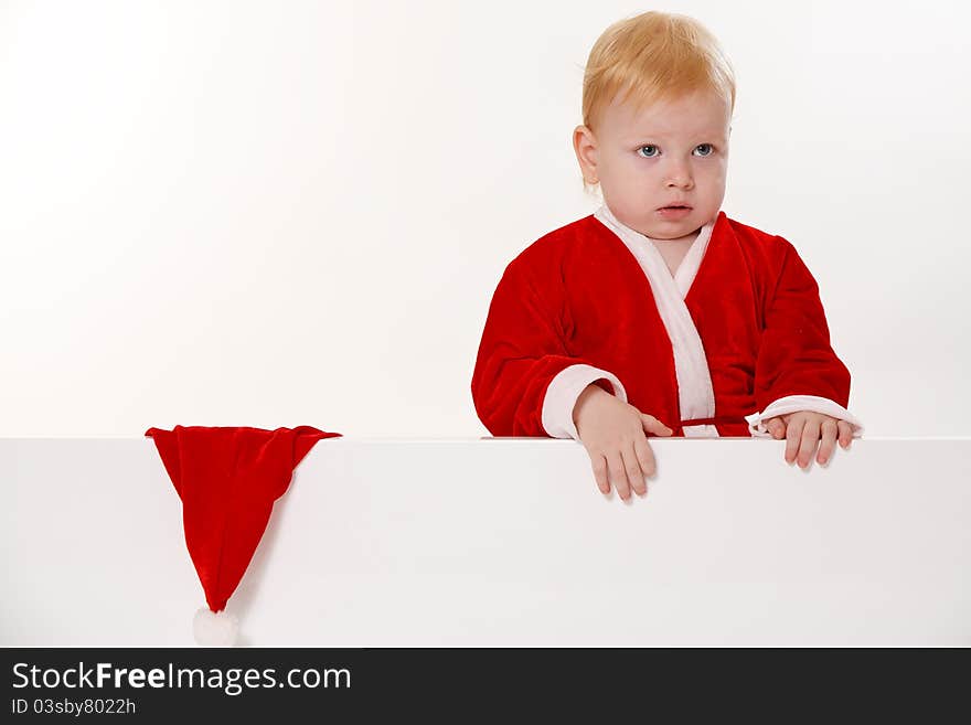 Child dressed as Santa Claus on a white background