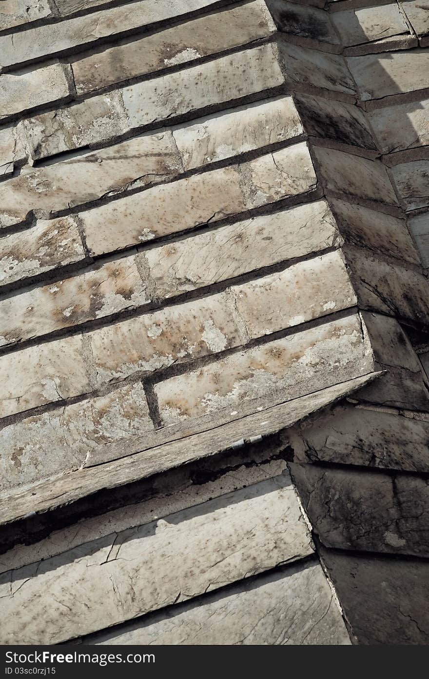 Background of decaying slate roof tiles