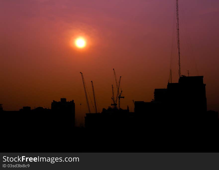 Construction at sunrise silhouette