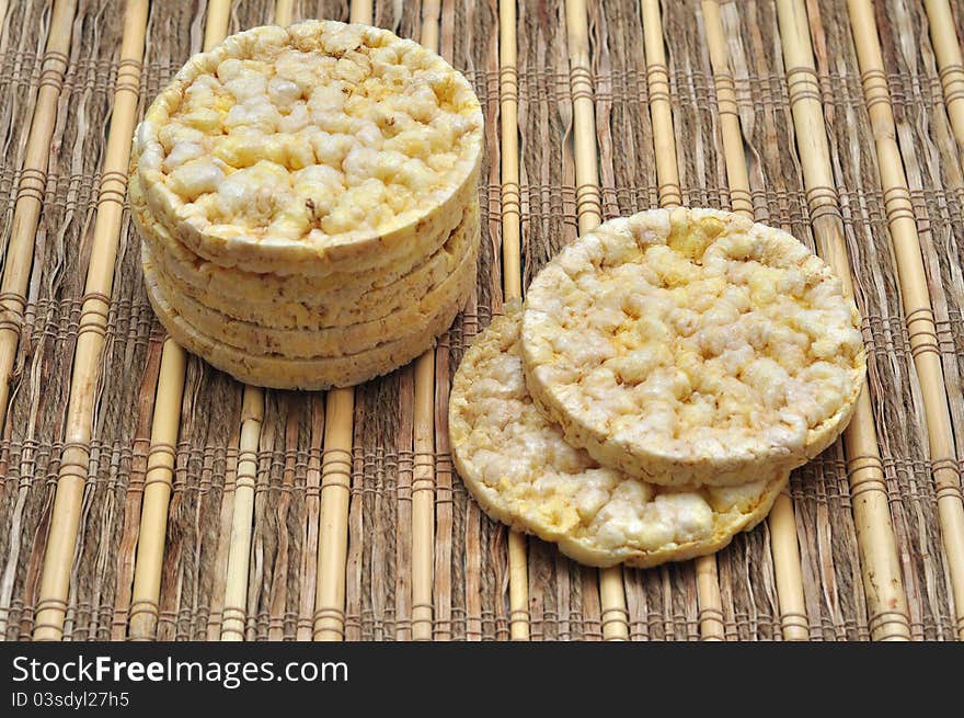 Round corn cakes over rustic surface