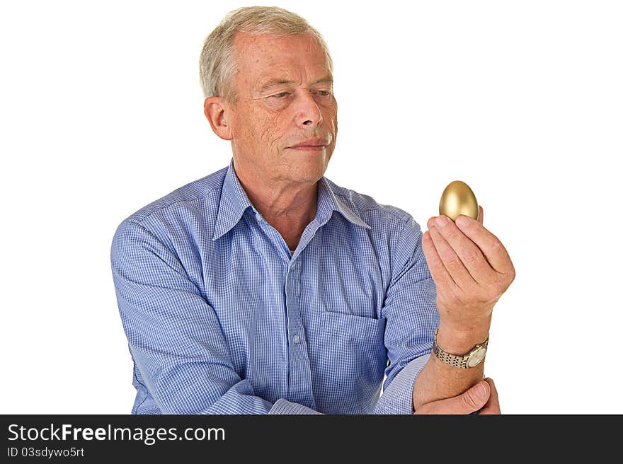 Senior man with golden egg