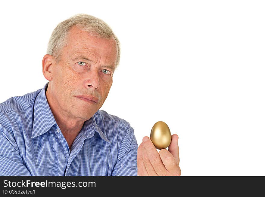 Senior man with his golden egg. His fortune/savings. Pleasent age. Senior man with his golden egg. His fortune/savings. Pleasent age.