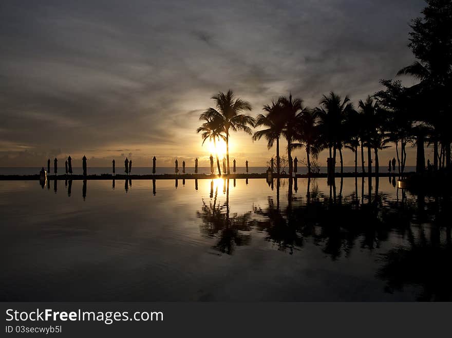 Pool and sea in the morning sunset , beach of Thailand. Pool and sea in the morning sunset , beach of Thailand