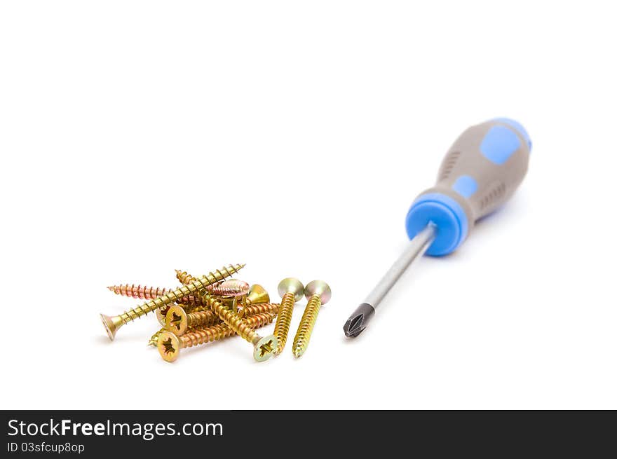 Screwdriver And Yellow Screws