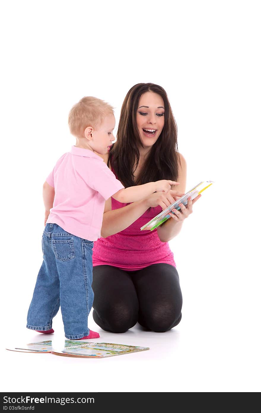 Beautiful happy mother with child 2 years boy read book. Beautiful happy mother with child 2 years boy read book