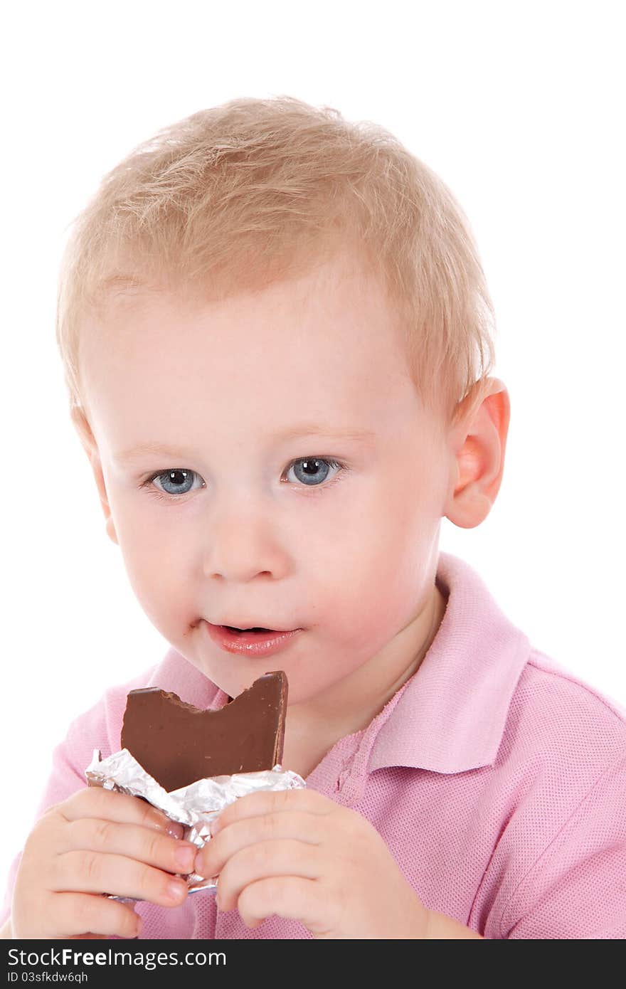 Little boy holding chocolate bar over white background