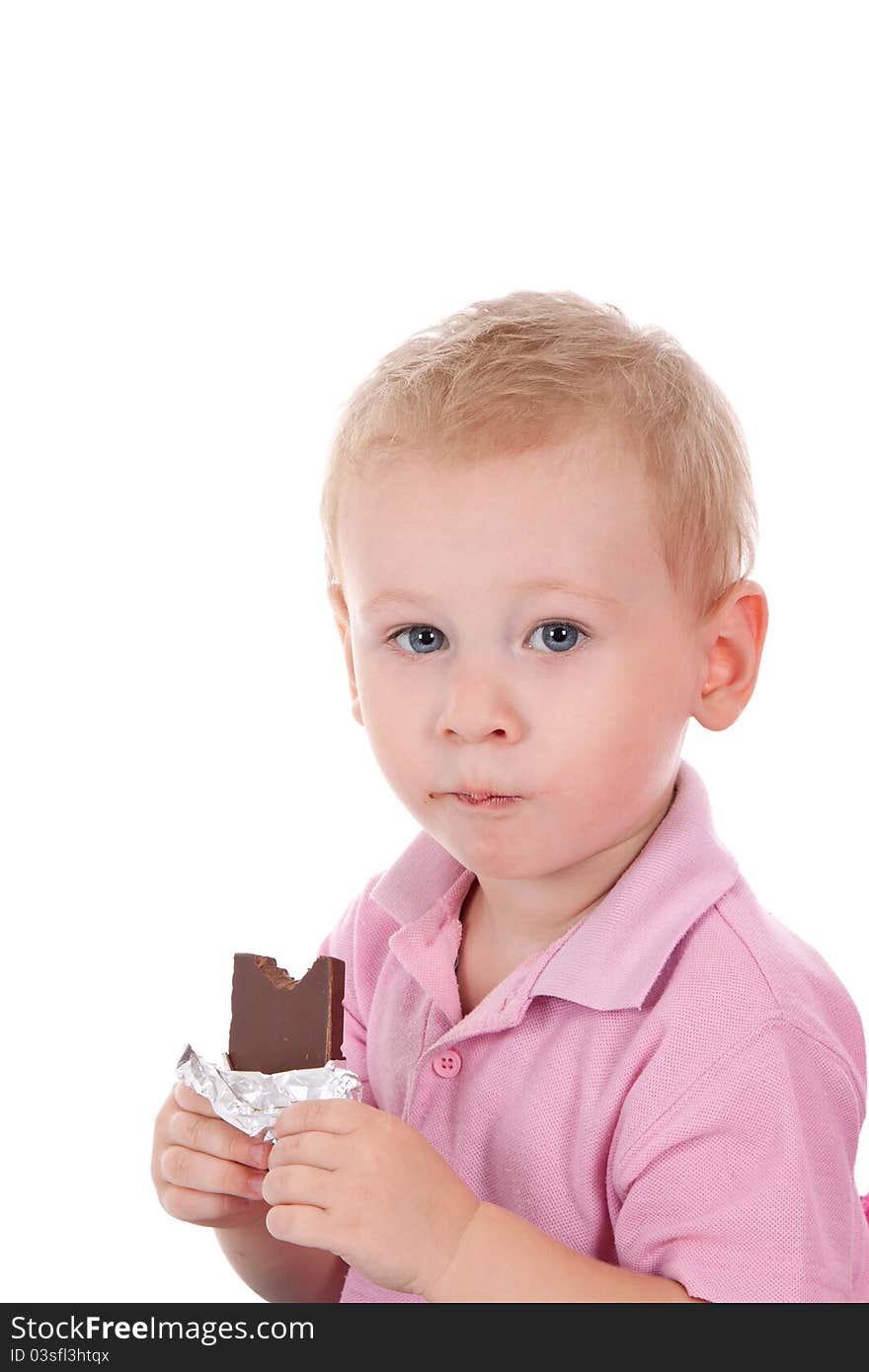 Little boy holding chocolate bar over white background