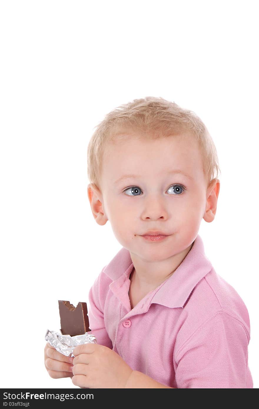 Little boy holding chocolate bar over white background