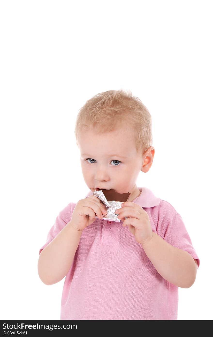 Little boy holding chocolate bar over white background