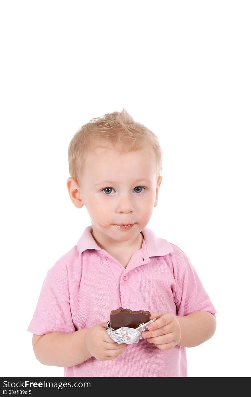 Little boy holding chocolate bar over white background