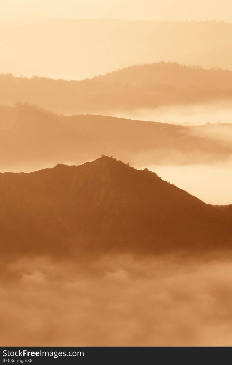 Foggy Panorama At Sunset