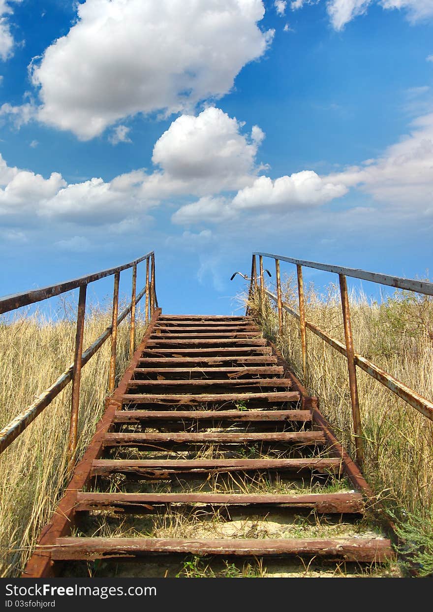 Staircase leading to the sky in which clouds float. Staircase leading to the sky in which clouds float