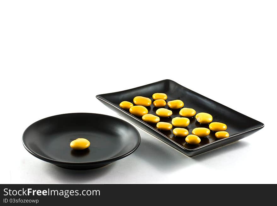 Group of mussels on a plate and one alone on another plate. Group of mussels on a plate and one alone on another plate