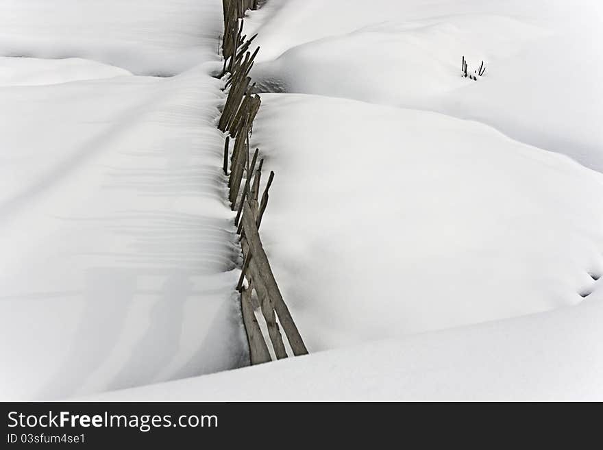 Wooden fence in the snow at Mestia, Georgia in winter 2011. Wooden fence in the snow at Mestia, Georgia in winter 2011