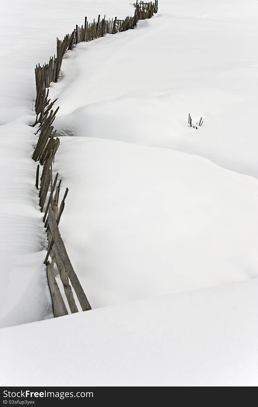 Wooden fence in the snow at Mestia, Georgia, winter 2011 (vertical). Wooden fence in the snow at Mestia, Georgia, winter 2011 (vertical)