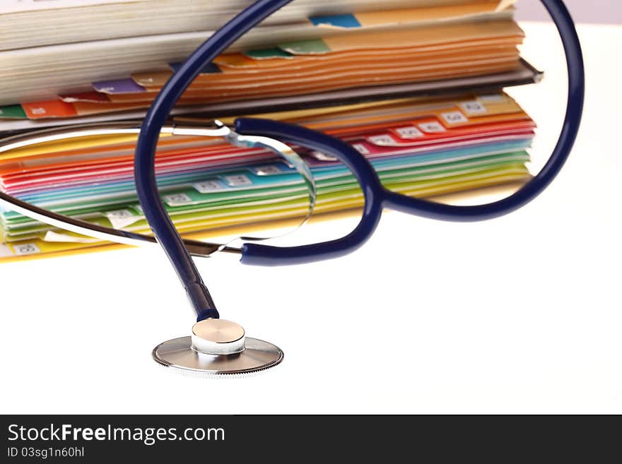 Books and stethoscope isolated