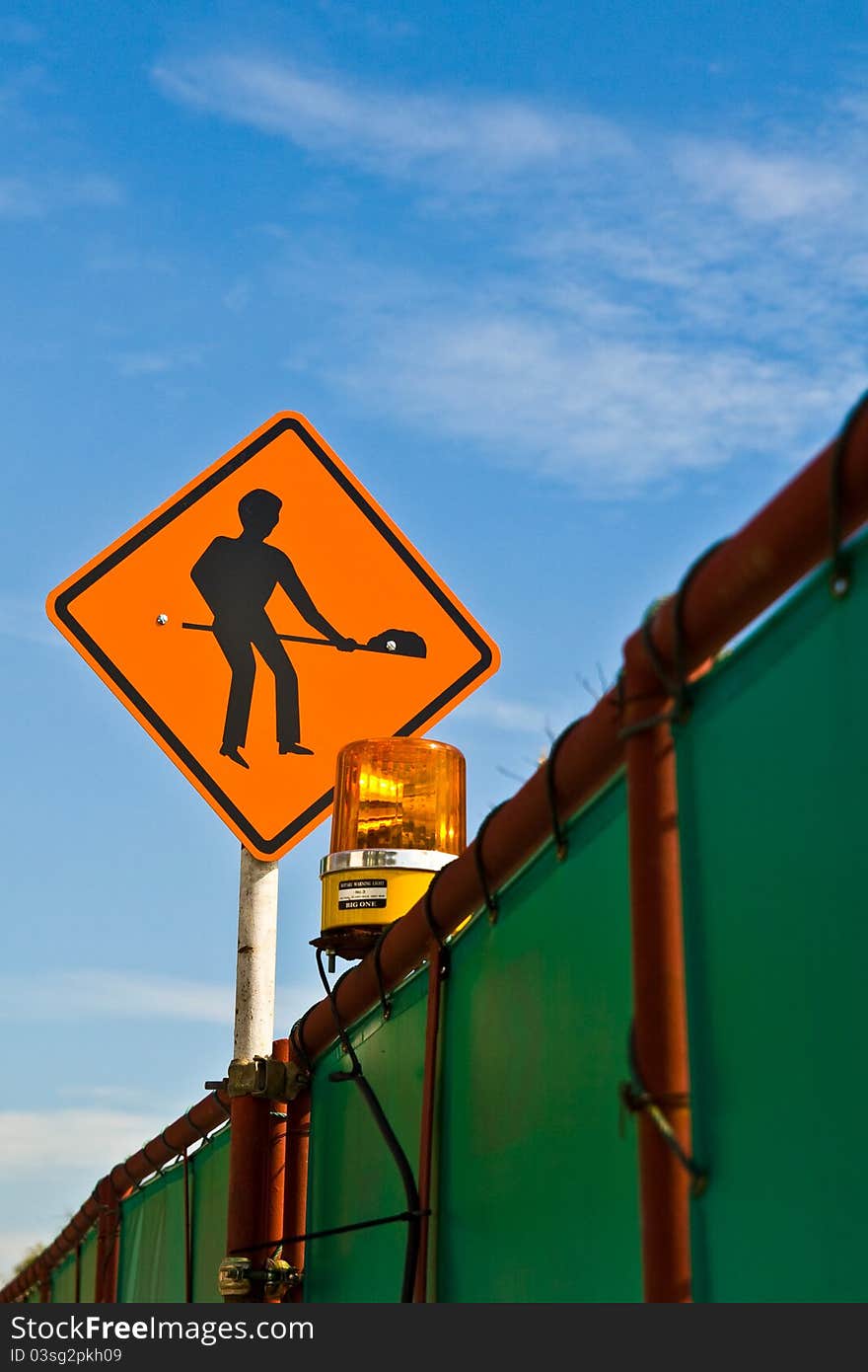 Worker sign at the road side