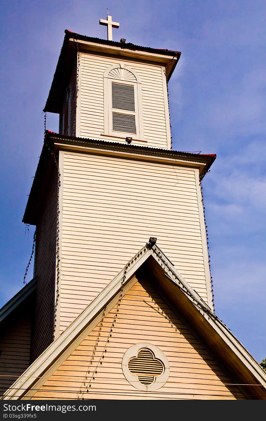 Cross silhouette against blue sky. Cross silhouette against blue sky