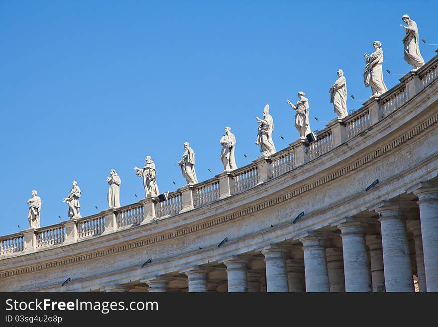 Statues in St. Peter Square (Rome, Italy) with blue sky background. Statues in St. Peter Square (Rome, Italy) with blue sky background