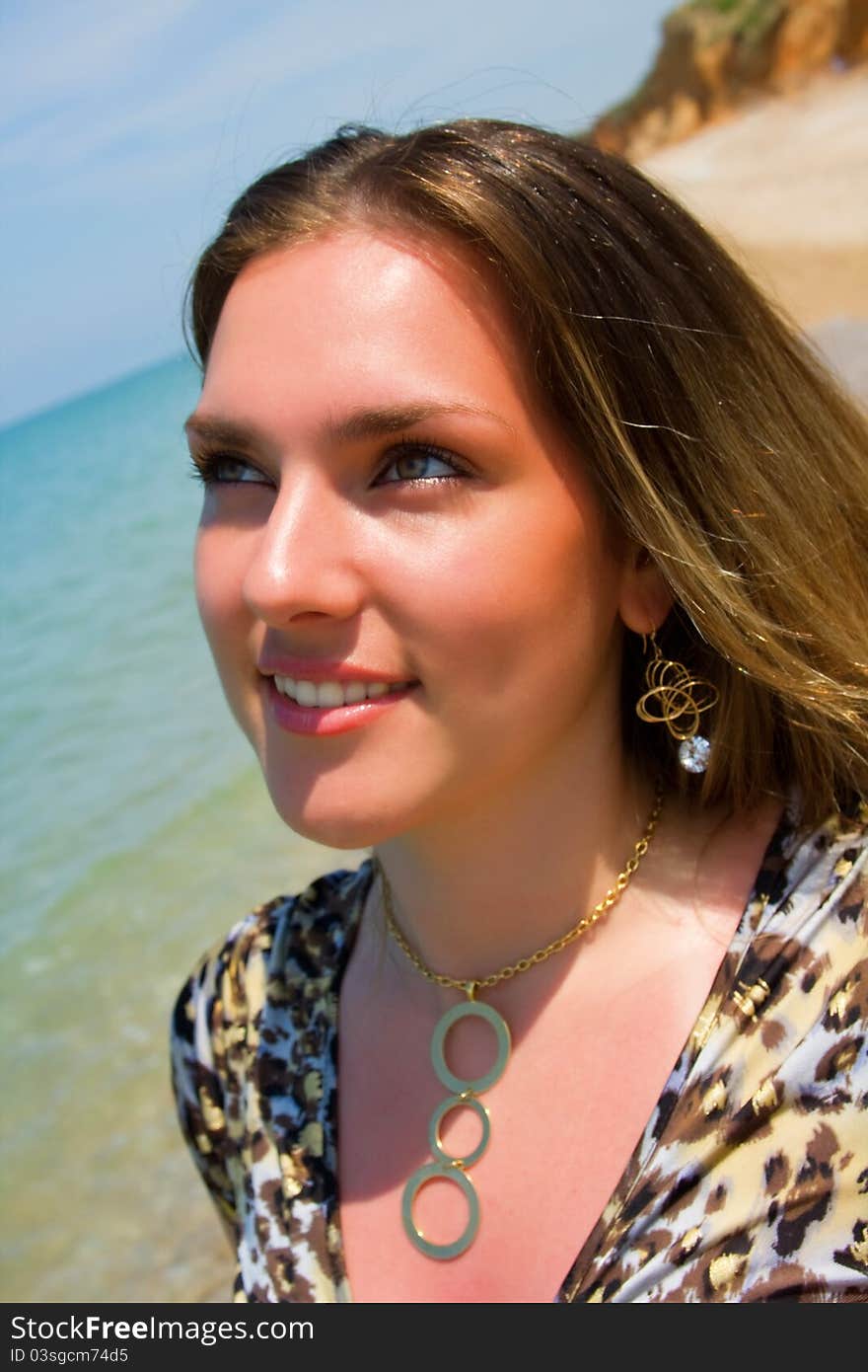 Pretty girl smiling on the sea