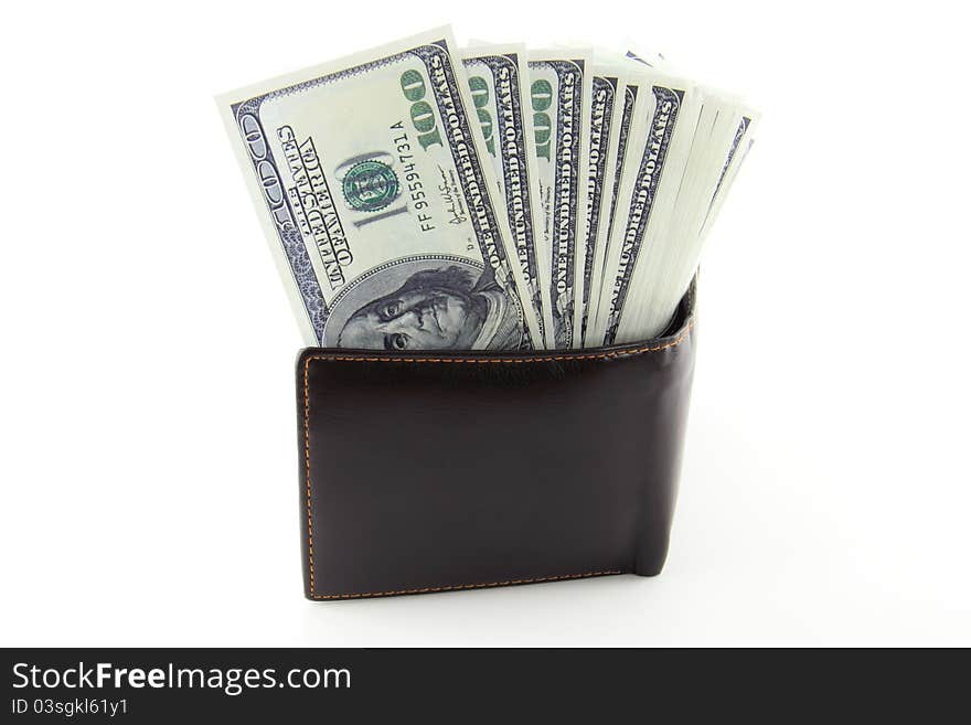 Money in brown leather purse isolated on white background