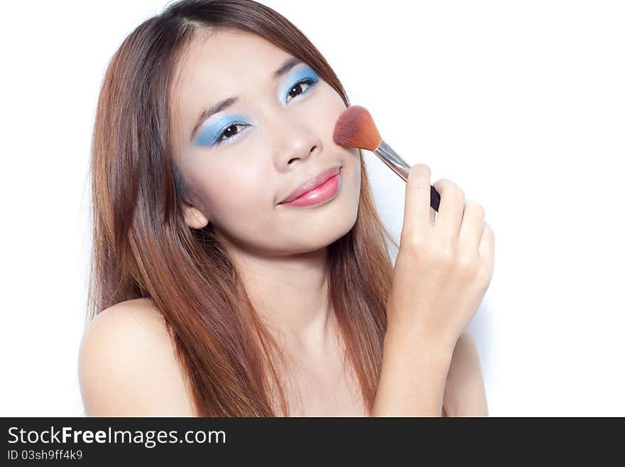 Asian girl with her make up brush