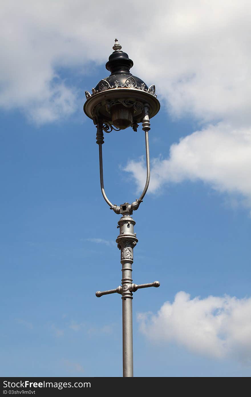 Old style lantern on blue sky background