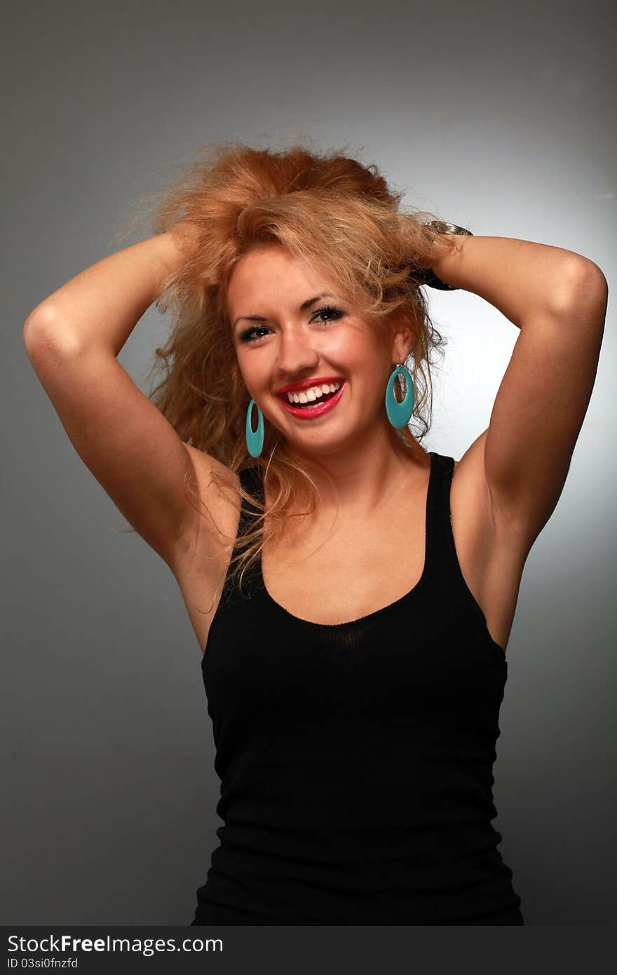 Portrait of a smiling  young woman wearing a shirt in studio. Portrait of a smiling  young woman wearing a shirt in studio