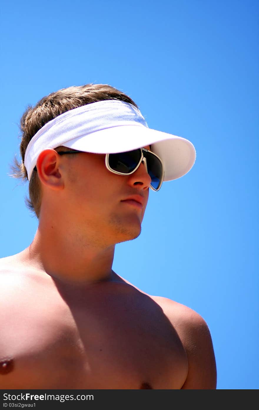 Attractive sports guy on the beach. Attractive sports guy on the beach